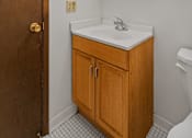 Thumbnail 16 of 23 - a small bathroom with a sink and a mirror