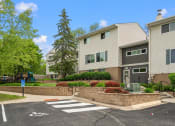 Thumbnail 34 of 57 - an apartment building with a pedestrian crossing in front of it