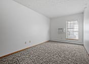 Thumbnail 6 of 27 - an empty room with carpet and a window