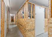 Thumbnail 24 of 25 - a room filled with insulation and wooden walls and a white door