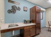 Thumbnail 41 of 51 - a kitchen with a sink and a microwave
