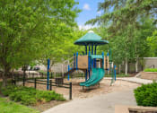 Thumbnail 33 of 57 - a playground with a blue playset and a slide