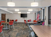 Thumbnail 55 of 55 - a dining room with tables and chairs and an flag