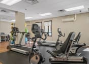 Thumbnail 51 of 51 - a gym with treadmills and other exercise equipment