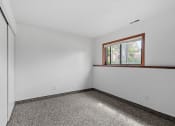 Thumbnail 12 of 43 - the living room of a house with white walls and a window
