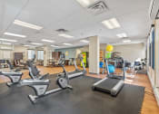 Thumbnail 4 of 51 - a gym with treadmills and other exercise equipment