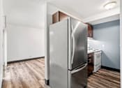 Thumbnail 35 of 40 - a renovated kitchen with stainless steel refrigerator and white appliances