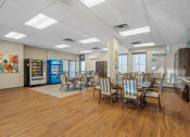 Thumbnail 1 of 51 - a dining room with tables and chairs and aacistacist in the front of a