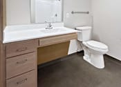 Thumbnail 12 of 22 - a bathroom with a sink toilet and a mirror
