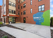 Thumbnail 3 of 26 - a building with a large mural on the side of it