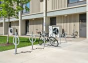 Thumbnail 35 of 51 - a row of bikes parked in front of a building