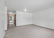 Thumbnail 8 of 43 - the living room of an empty house with white walls and carpet