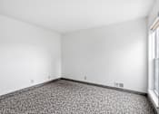 Thumbnail 32 of 40 - an empty room with carpet and a window
