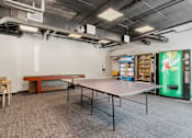 Thumbnail 45 of 55 - a room with a ping pong table and a pool table