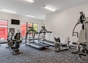 Thumbnail 30 of 35 - the gym has cardio equipment and weights at the flats