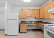 Thumbnail 5 of 43 - an empty kitchen with a sink and refrigerator