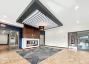 Thumbnail 7 of 36 - the preserve at cardinal courts lobby with fireplace and glass doors