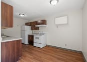 Thumbnail 23 of 57 - a kitchen with white appliances and wooden flooring and a white refrigerator