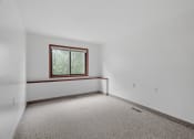 Thumbnail 43 of 43 - the living room of an empty house with a window