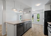 Thumbnail 5 of 53 - a kitchen with a counter top and a sink