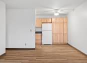Thumbnail 11 of 25 - a kitchen with a white refrigerator and wooden cabinets