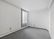 Thumbnail 6 of 51 - an empty room with carpet and a window