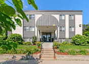 Thumbnail 3 of 9 - the front of a building with stairs in front of it