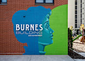 Thumbnail 25 of 26 - a mural on the side of a building of burnes building
