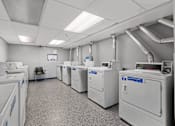 Thumbnail 53 of 55 - a room filled with washers and dryers