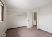 Thumbnail 11 of 57 - a bedroom with a closet and a door to a bathroom