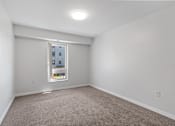 Thumbnail 16 of 53 - a room with white walls and a window