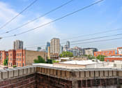 Thumbnail 60 of 67 - the view of the city from the roof of a building