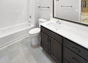 Thumbnail 9 of 24 - a bathroom with a sink toilet and a shower