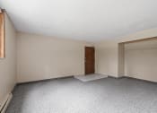 Thumbnail 13 of 57 - an empty living room with a door to a closet