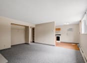 Thumbnail 12 of 57 - an empty living room with a door to a closet and a window