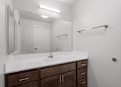 Thumbnail 13 of 53 - an empty bathroom with a sink and a mirror