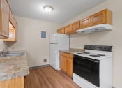 Thumbnail 8 of 57 - a kitchen with a stove oven and a refrigerator