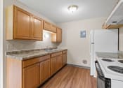 Thumbnail 7 of 57 - a kitchen with a stove refrigerator and a sink