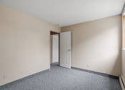 Thumbnail 4 of 57 - an empty bedroom with a door open to a closet