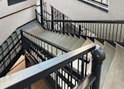 Thumbnail 20 of 24 - a view of a building from the top of a staircase