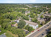 Thumbnail 22 of 23 - an aerial view of a city with a road and buildings
