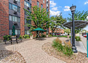 Thumbnail 7 of 55 - our apartments offer a spacious courtyard with picnic tables and umbrellas
