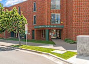 Thumbnail 5 of 25 - a brick building with a sign that reads