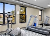 Thumbnail 15 of 30 - two treadmills and other exercise equipment in a gym