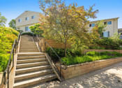 Thumbnail 50 of 57 - stairs leading up to a building with a tree in front of it