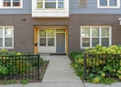 Thumbnail 38 of 52 - the front of a brick house with a sidewalk in front