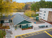 Thumbnail 3 of 25 - an aerial view of a building with a green house and a playground