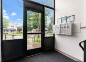 Thumbnail 20 of 27 - the entrance to a office with a door and a window