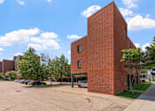Thumbnail 19 of 25 - a red brick building on the corner of a street