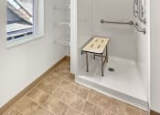 Thumbnail 3 of 52 - a white bathroom with a shower and a window